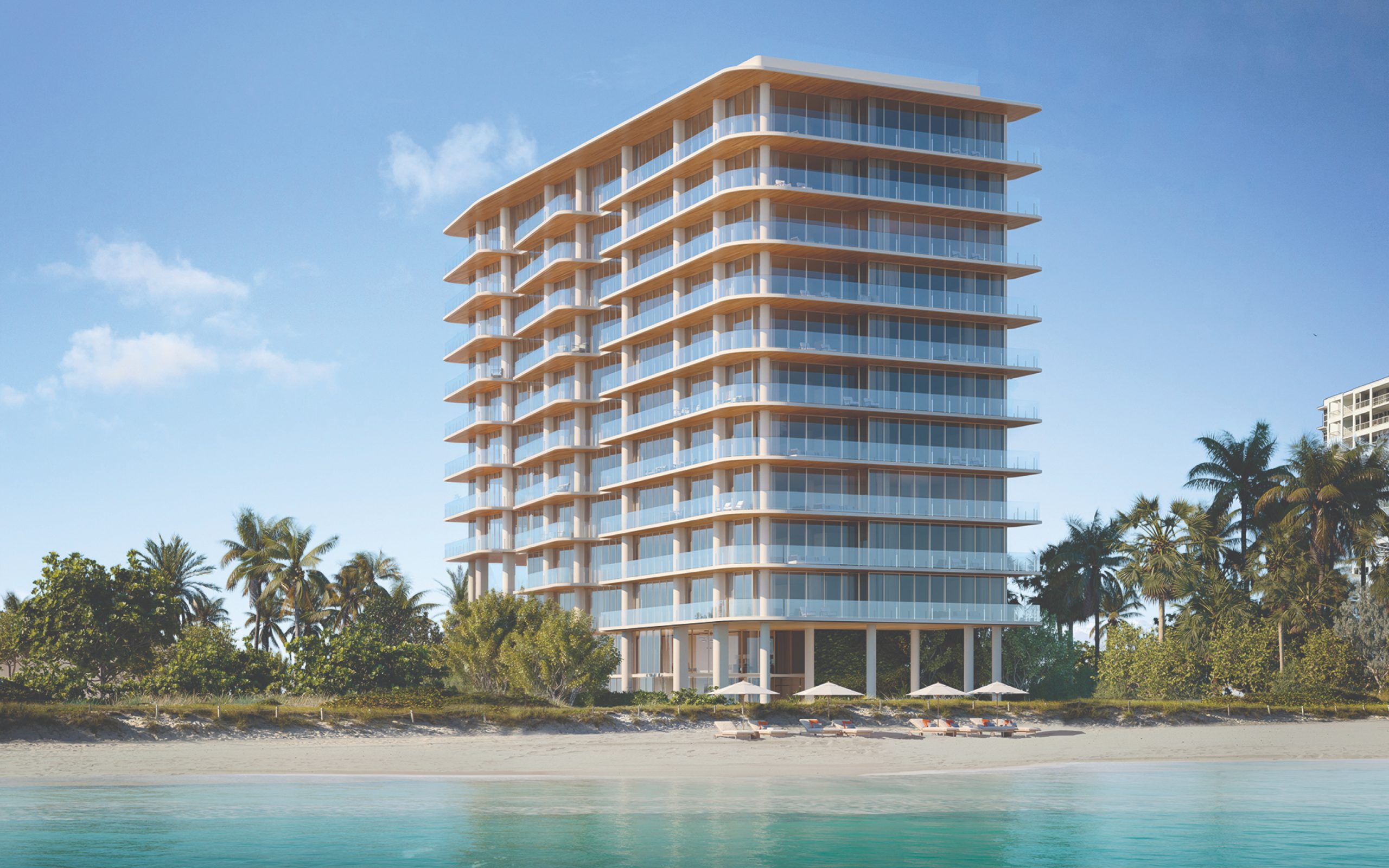 Exterior of Ocean House Surfside condominiums in Miami Beach, with balconies on each floor and beach in foreground.