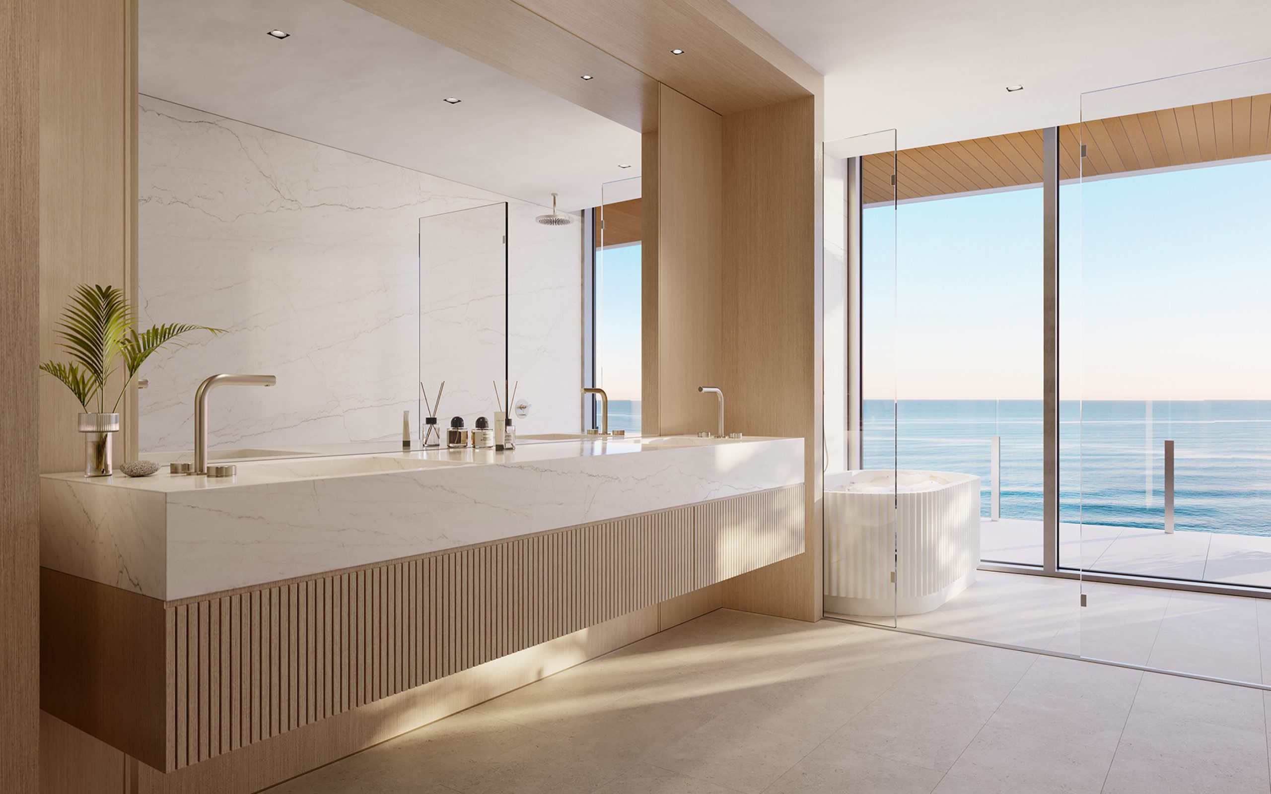 Luxury bathroom with large elegant fixture, huge mirror and bath with open ocean views at Ocean House luxury condos in Miami.