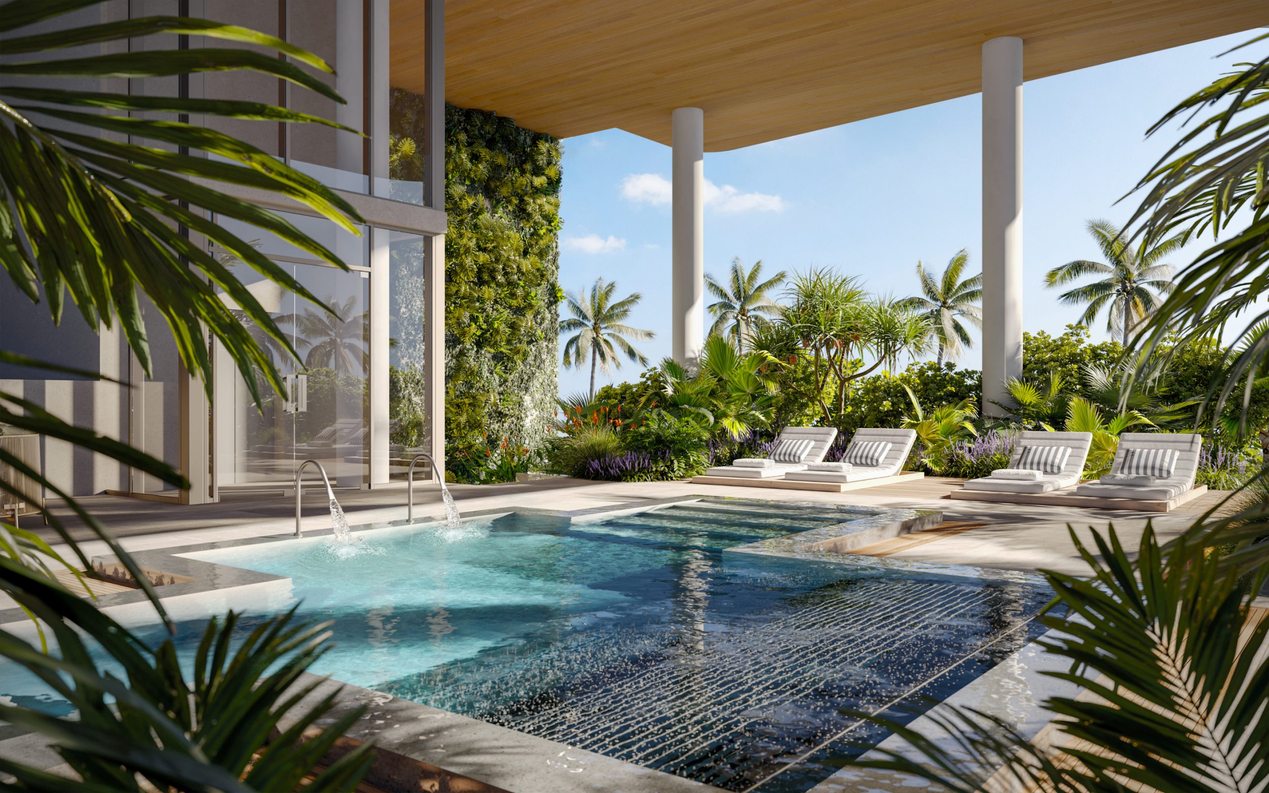 Stunning swimming pool surrounded by greenery, an exclusive amenity at Ocean House luxury oceanfront condos in Miami.